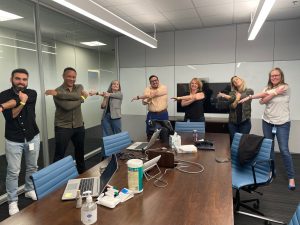 Team stretching in meeting