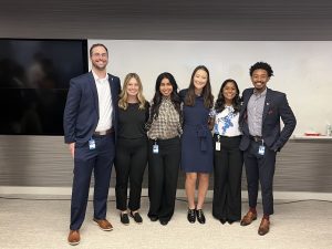 Members of the winning team pose together in an AT&T office