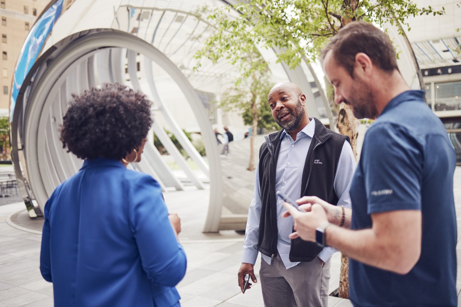 AT&T employees converse in the AT&T Discovery District