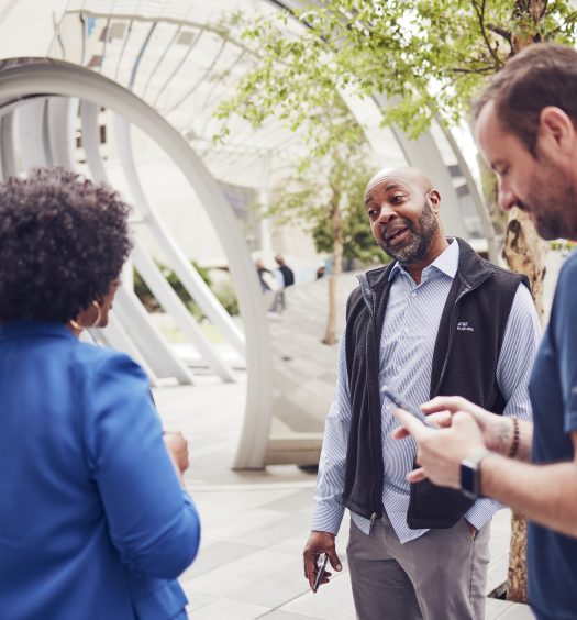 AT&T employees converse in the AT&T Discovery District