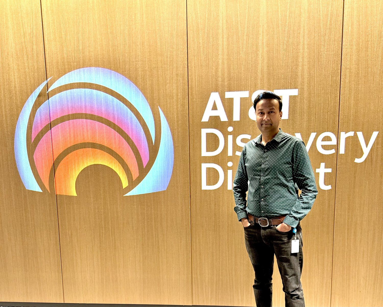 Kartik in front of the AT&T Discovery District sign