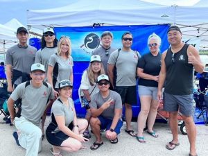 Race team poses at event