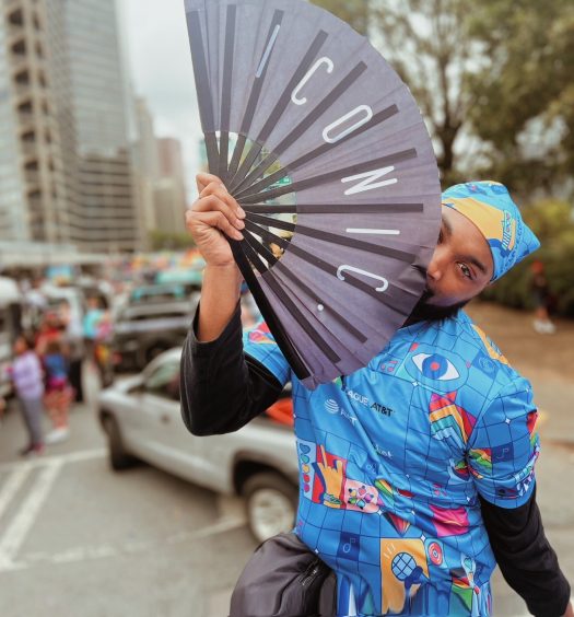 Zaryland poses with hand fan at Atlanta Pride