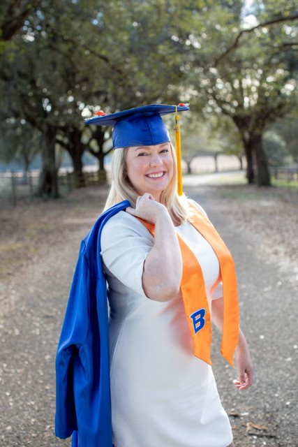 Cher in graduation robes