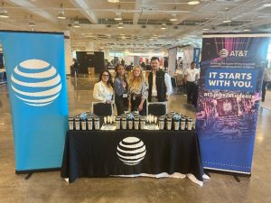 Team members work an AT&T event booth