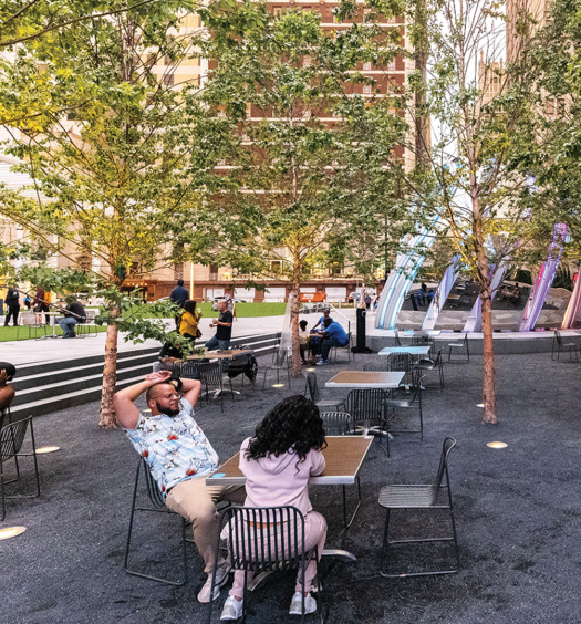 people talking at an outdoor table