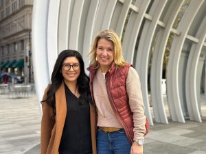 two women pose for a photo