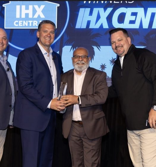 Ejaz receives an award from business leaders