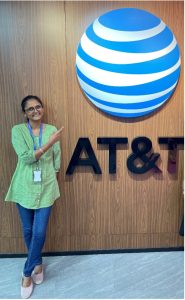 Renuka poses by AT&T globe sign