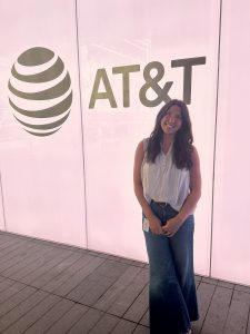 Katie in front of AT&T globe logo