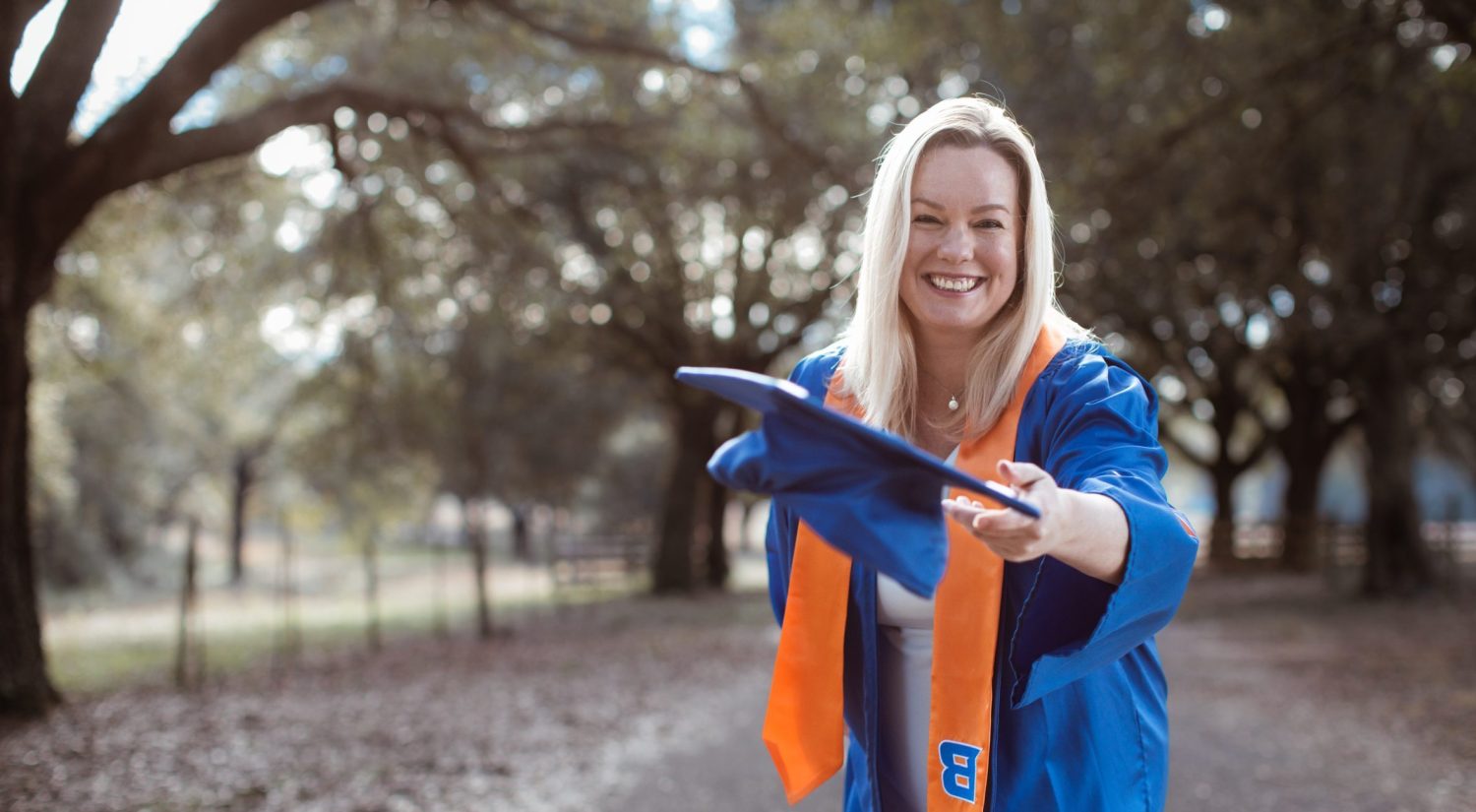 Cher in graduation gown