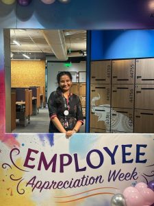 Meghna with employee appreciation week sign