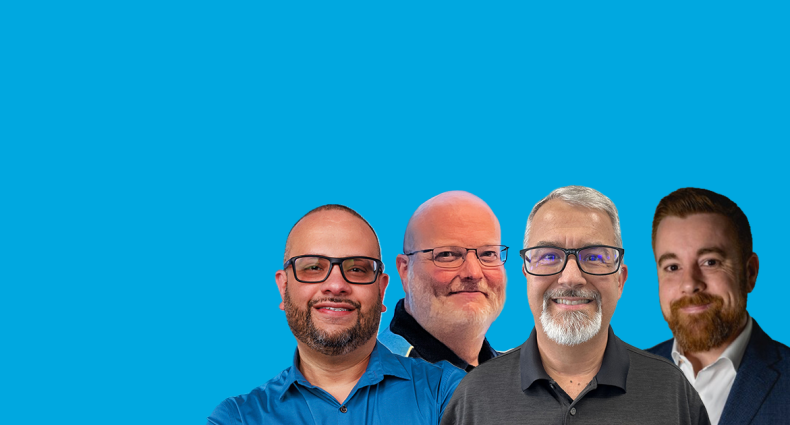 Four men in business and AT&T attire