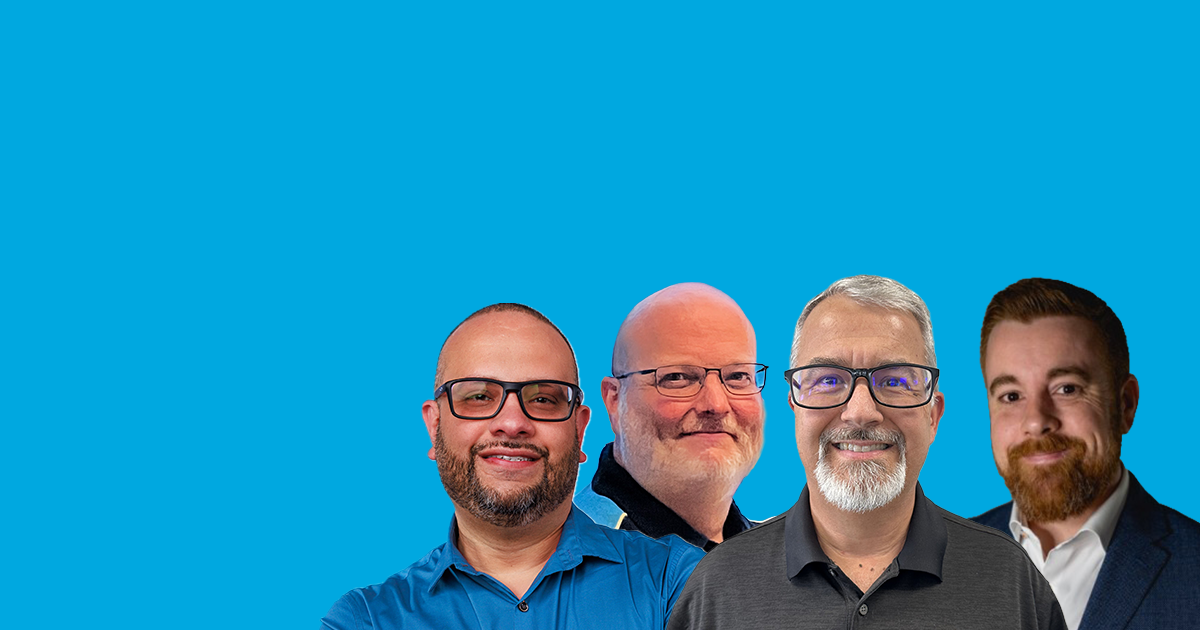 Four men in business and AT&T attire